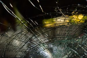 Shattered windshield from road debris