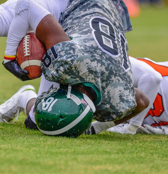 High School football player being tackled