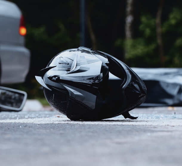 motorcycle helmet lying on road after accident