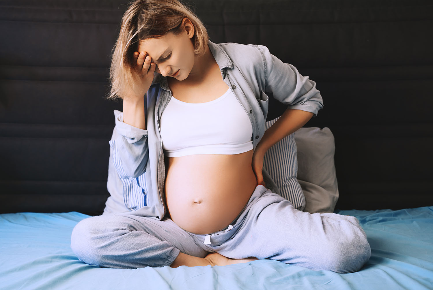 pregnant woman suffering from pregnancy issues