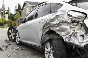 Severe damage to a car after being hit from a tailgating car crash