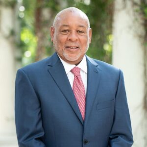 Victor E. Long, a prominent civil rights lawyer and partner at Regan Zambri Long PLLC in Washington, DC, stands confidently in a formal blue suit and red tie. With decades of experience advocating for victims of constitutional violations, unlawful arrests, discrimination, and police misconduct, Mr. Long is known for his strategic litigation skills and deep commitment to justice. He represents individuals and families throughout the DC area who have experienced abuse of power, due process violations, and systemic injustice.
