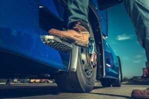 truck driver stepping up into truck