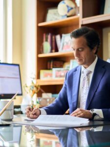 Regan Zambri Long partner Sal Zambri seated at desk. wrongful death lawyer