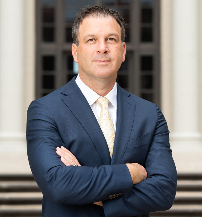 A professional boat accident lawyer in Baltimore, MD, stands confidently outside a courthouse, representing legal expertise in maritime injury cases. Regan Zambri Long, a leading personal injury law firm, offers legal support for victims of boat accidents. Seeking experienced representation ensures injured clients receive fair compensation for medical expenses, property damage, and other losses related to boating accidents. Contact (202) 960-4596 for legal assistance.