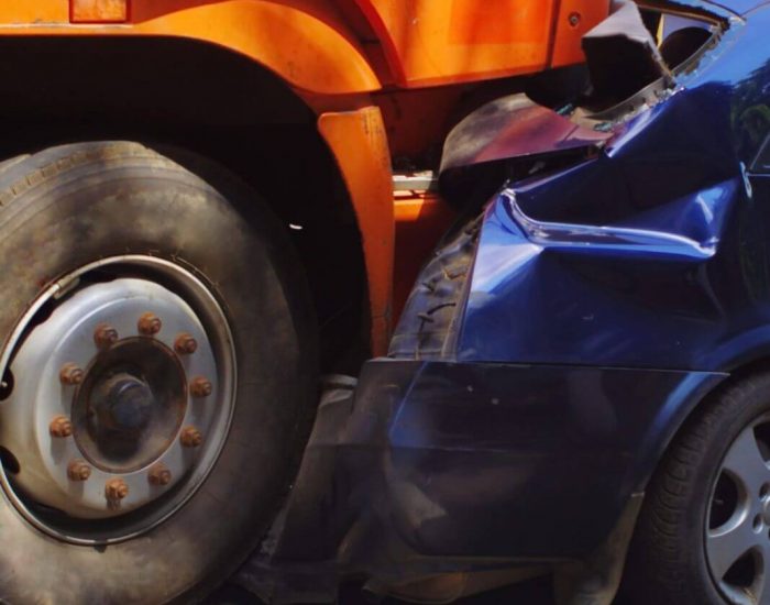 truck rear ends small passenger car - red light accident lawyer